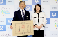 写真：星野誠さん（左）